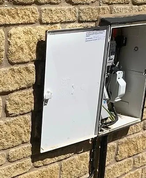Metal enclosure and isolator installed on an outdoor wall by SEE Electrical