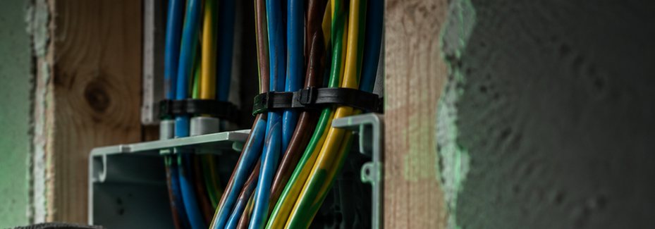 Bundled cables behind a wall during a house rewire