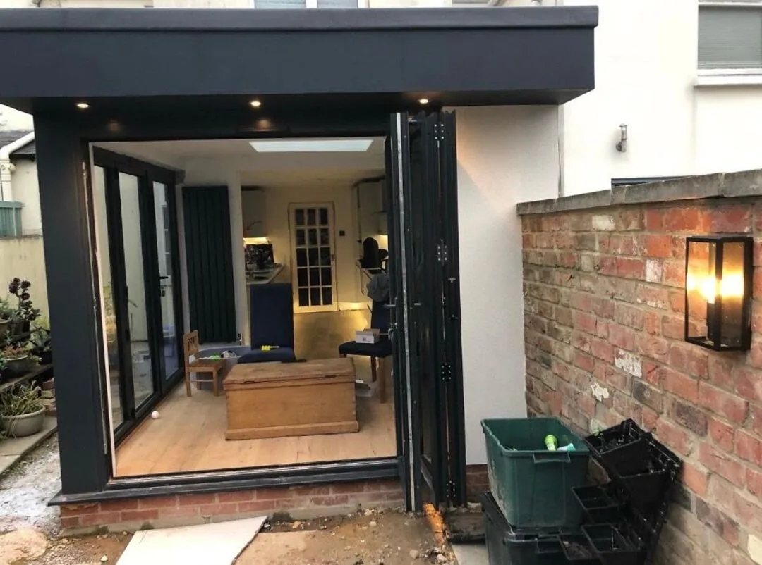 Soffit downlights and an outdoor wall lantern wired into a rear house extension by SEE Electrical in Worcester